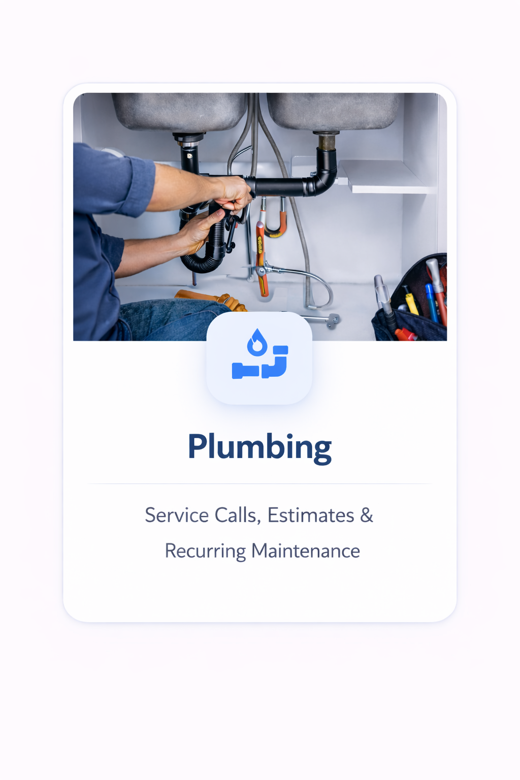 Plumber repairing pipes under a kitchen sink